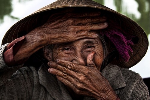 A Hoi An old woman with a shy smile